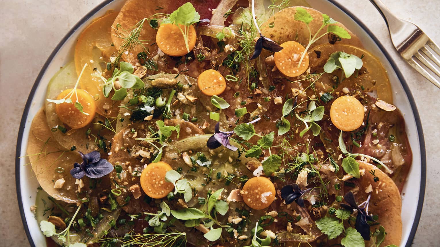 A bowl of salad and herbs.