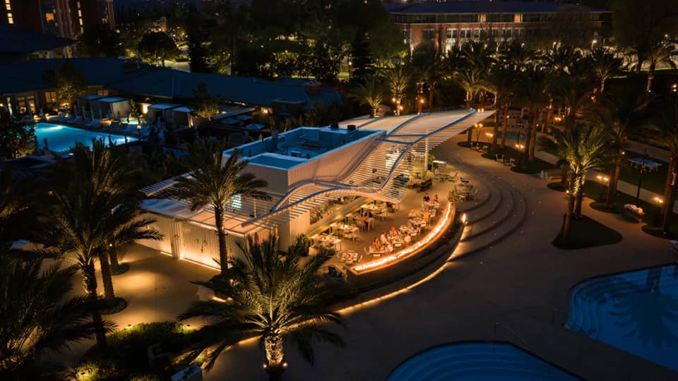Aerial view of outdoor poolside restaurant at night