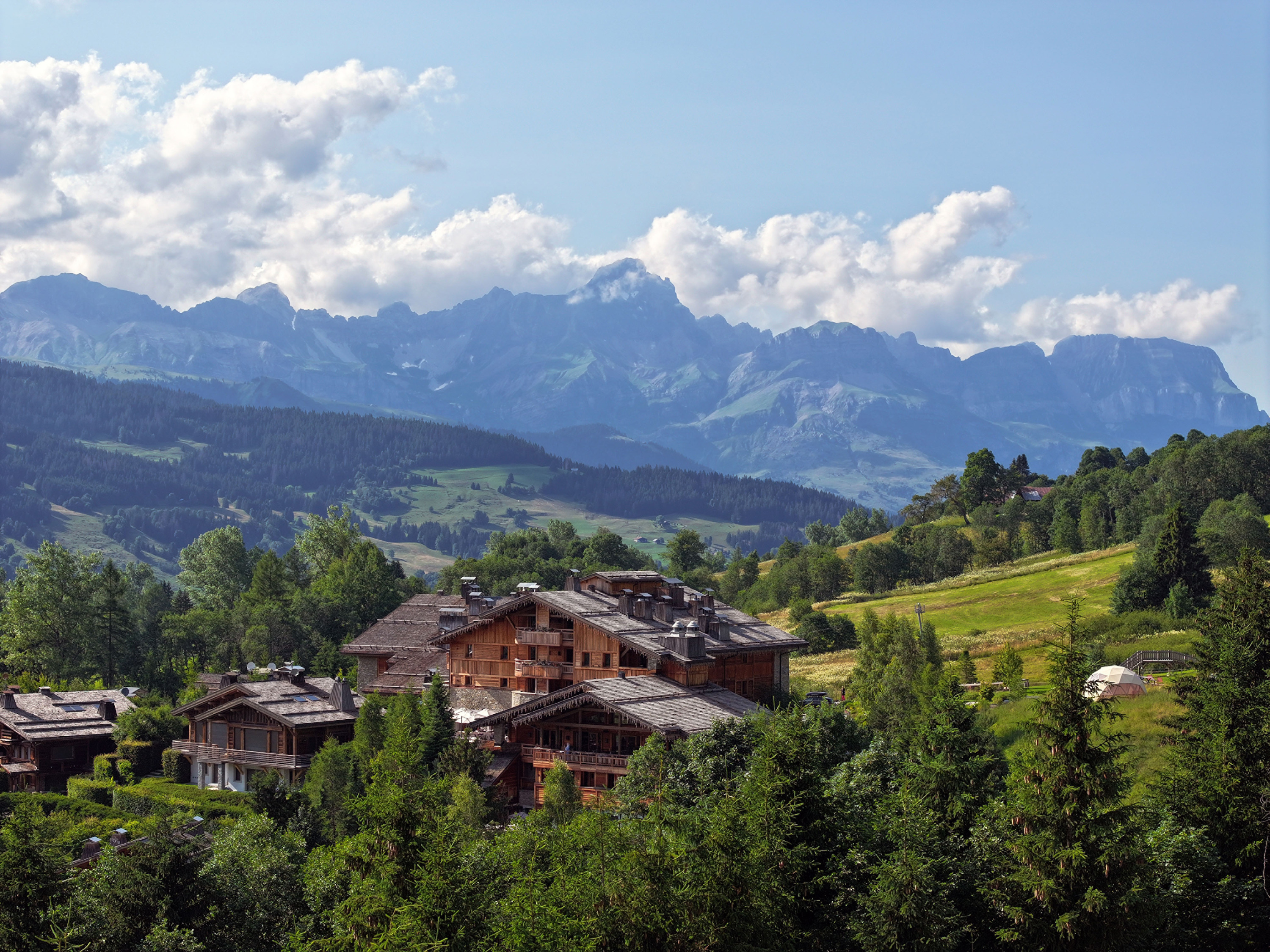 Exterior view of Four Seasons Resort Megève nestled in the snowy French Alps