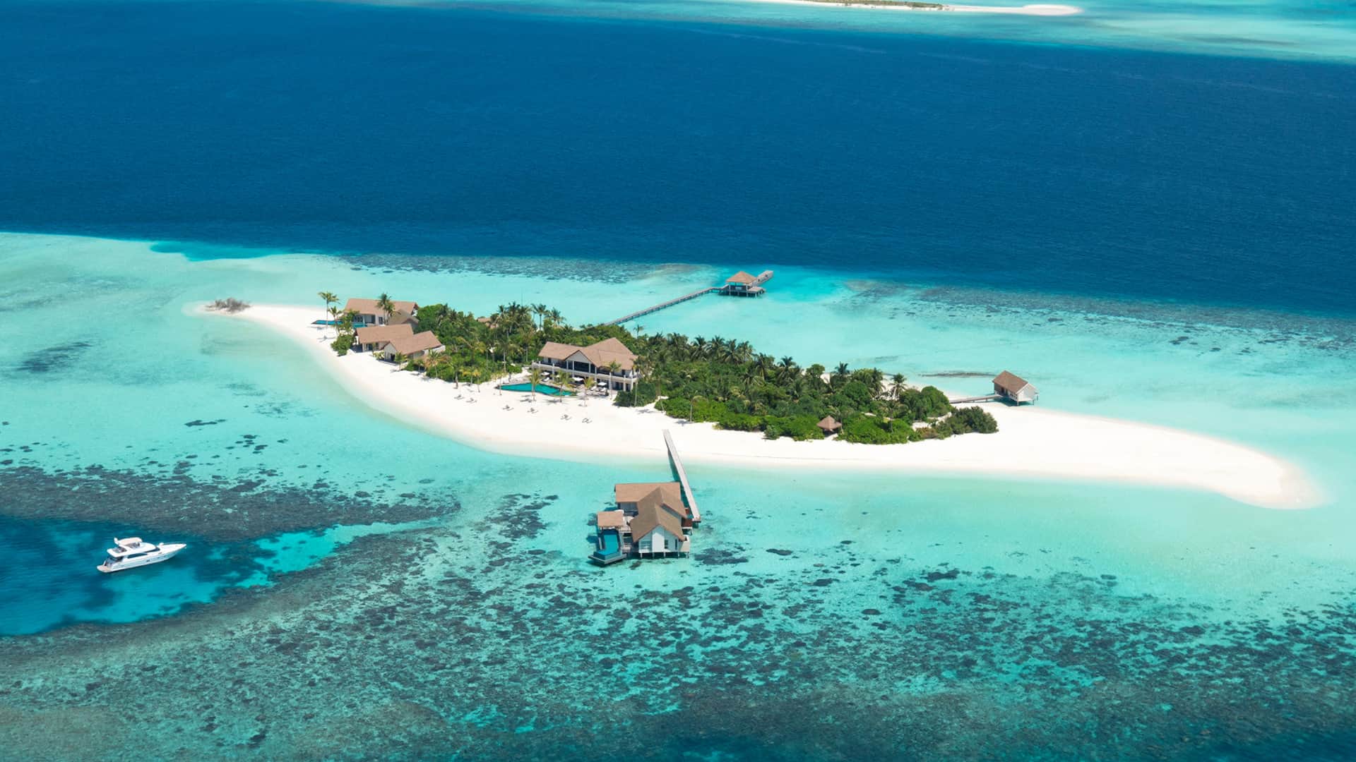 Aerial view of Four Seasons Private Island Maldives at Voavah — 5-acre buyout island in Baa Atoll