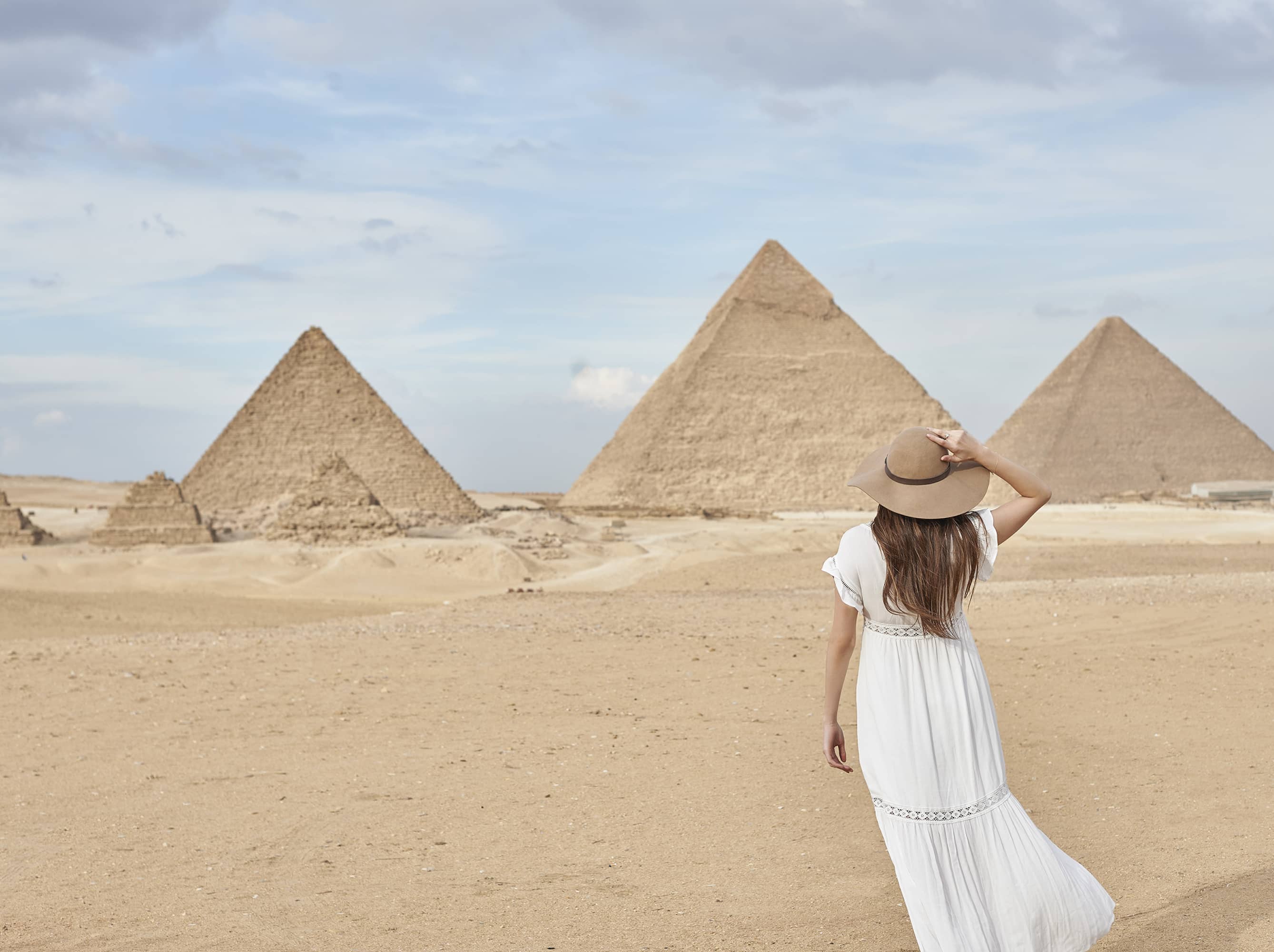  Visit the iconic Pyramids at Giza.  