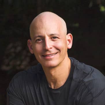 Harley Pasternak, Global Fitness Advisor, poses on a fitness machine