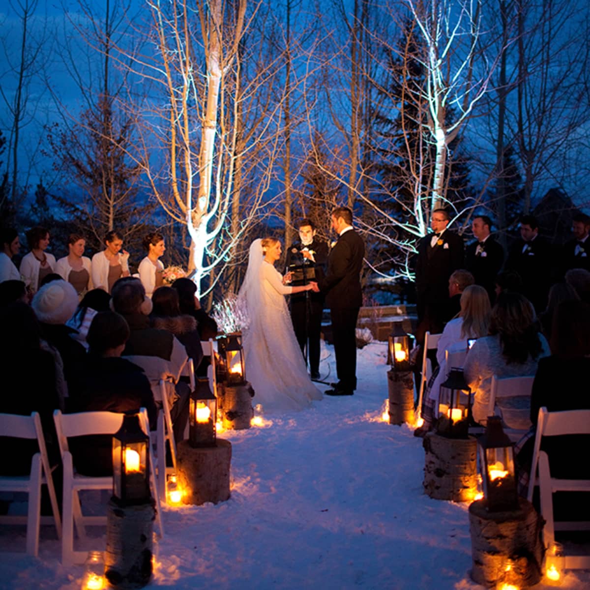 Jackson Hole Winter Wedding Four Seasons Resort Residences Lanterns Atop Tree Stumps Line The Aisle