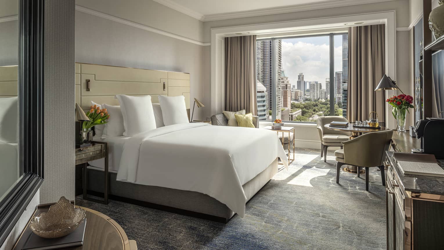 Guest room with a king bed at Four Seasons Hotel Singapore