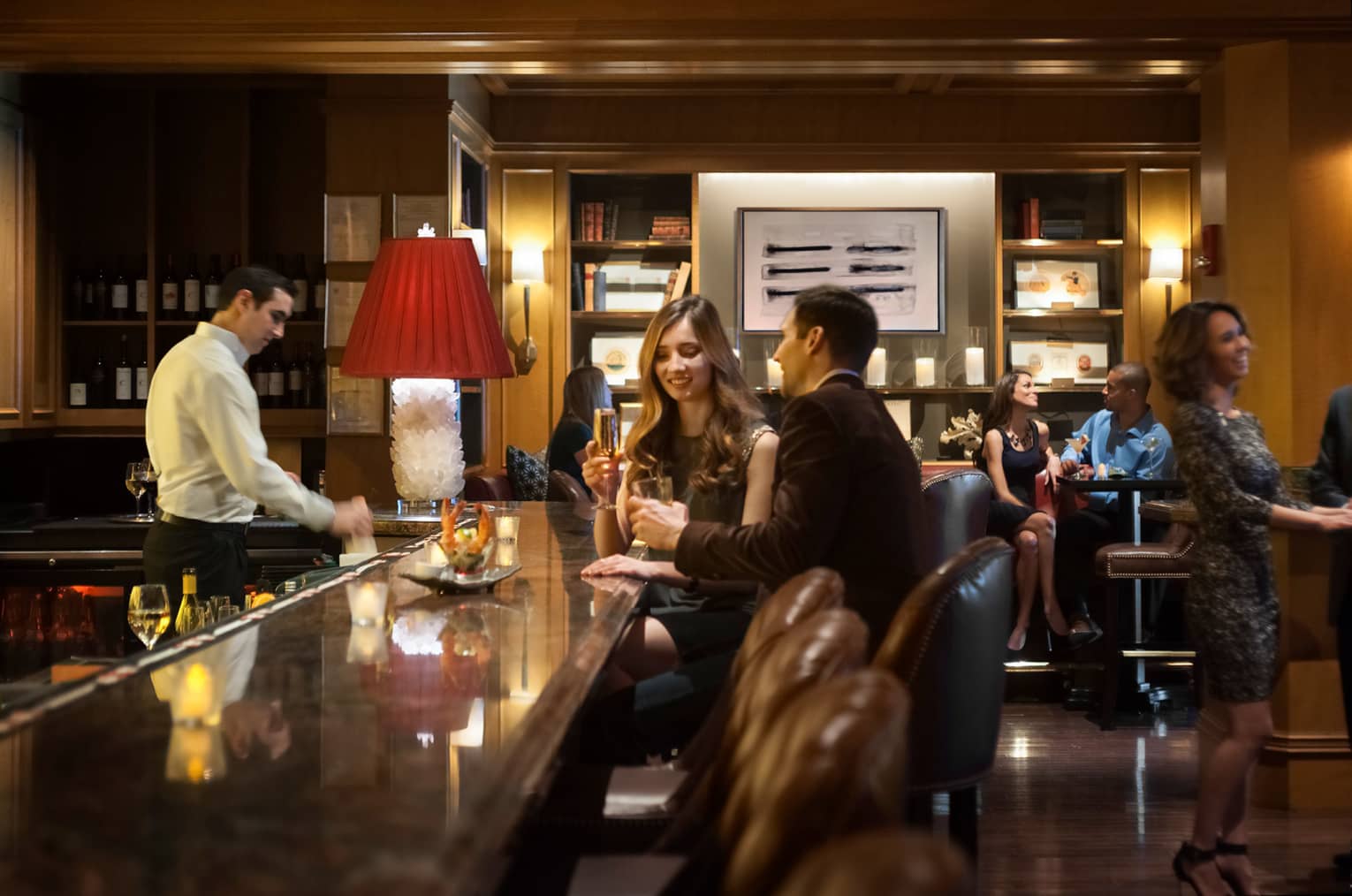 Fine Dining Boston Restaurants Bars Four Seasons Hotel Woman And Man At End Of Bristol Bar Rail Lean In Hold Champagne Gles