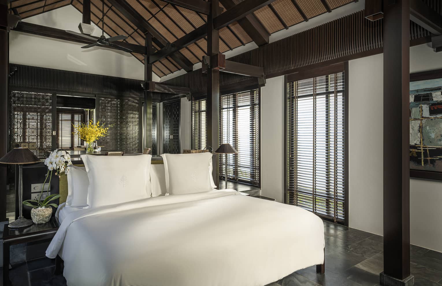 King bed in a private villa with vaulted ceiling