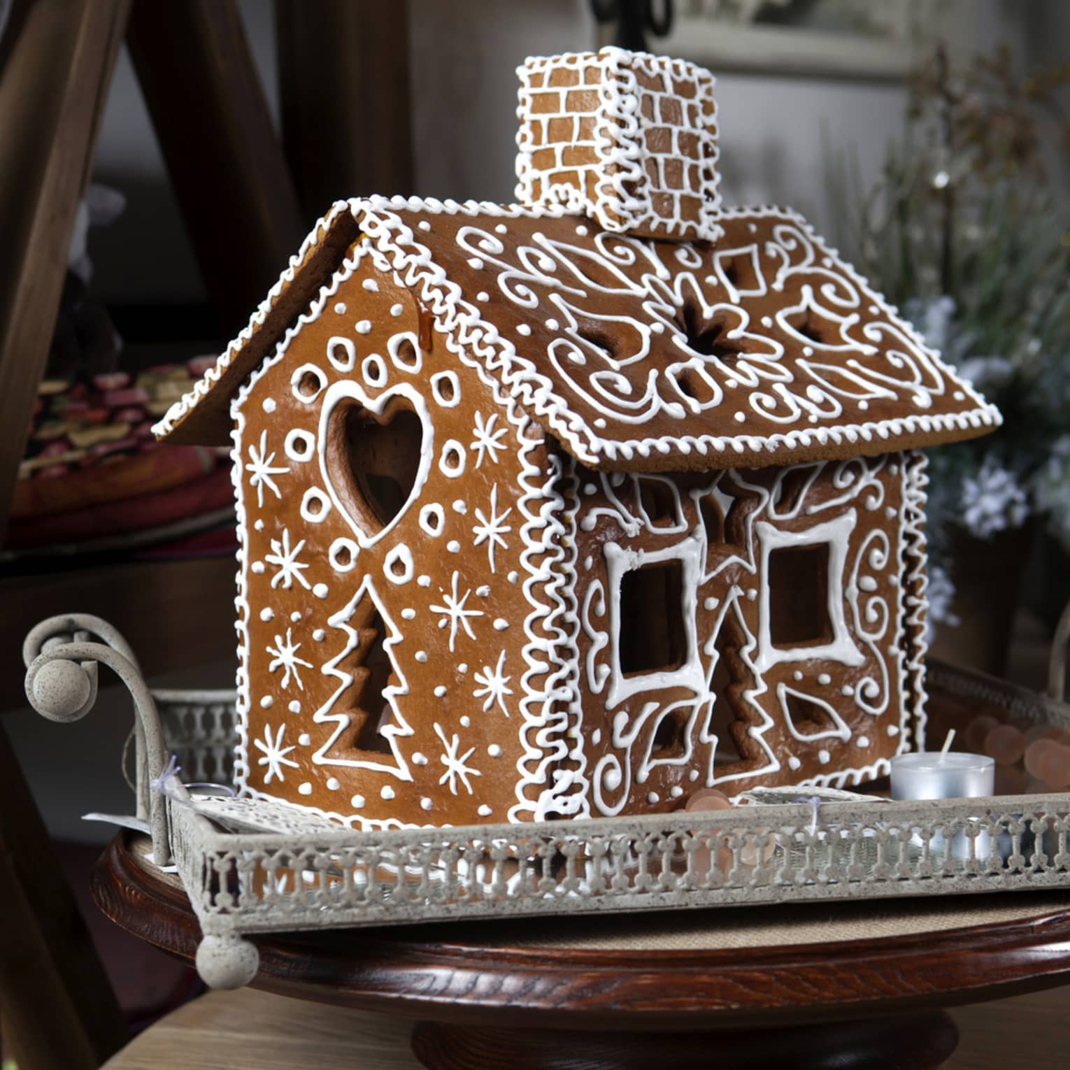 Gingerbread house decorated with white frosting