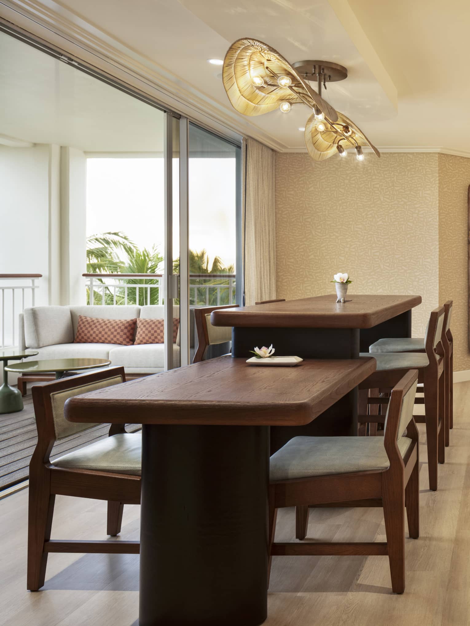 Self-serve counter and two dining tables of different heights in an executive club lounge at resort