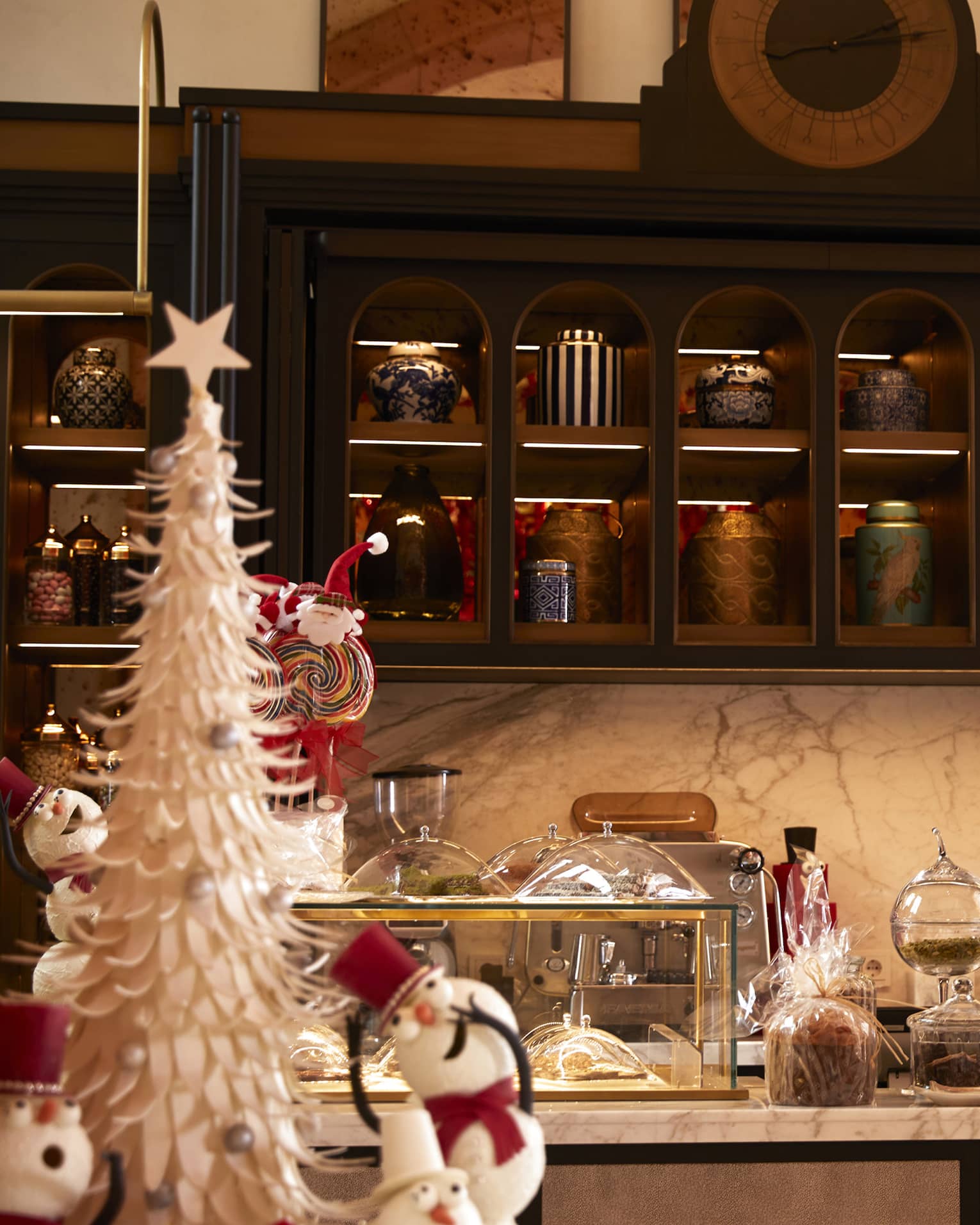 La Pistache restaurant buffet filled with Christmas decor, including shiny trees, ornaments, and snowmen