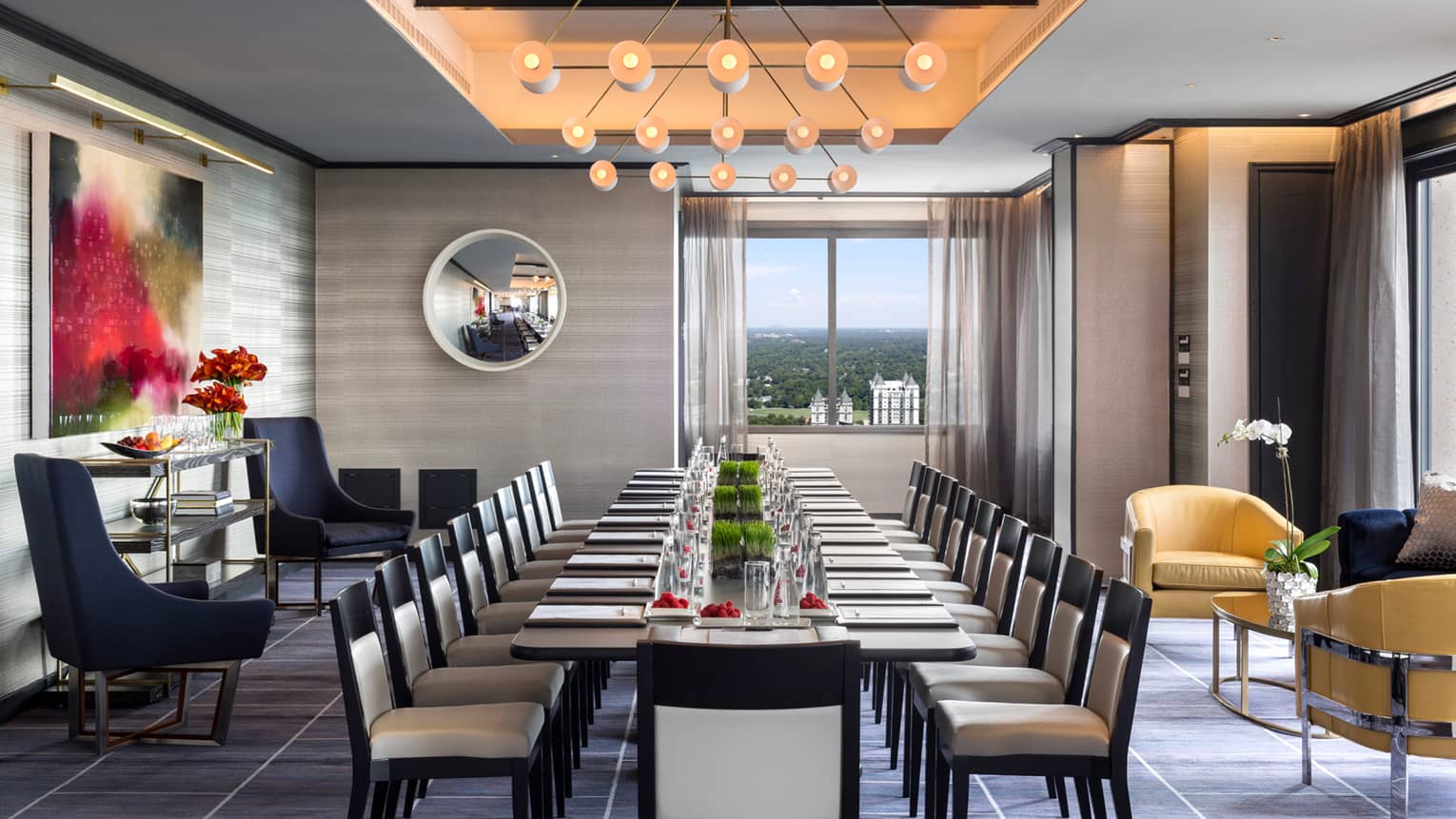 Penthouse Ballroom with long corporate meeting table, chairs and modern decor 