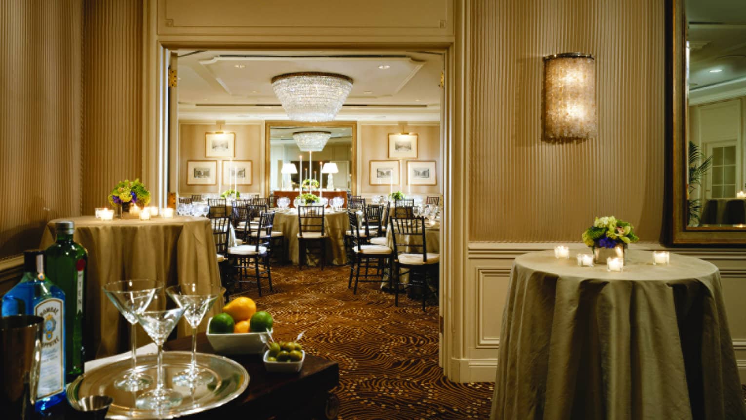 Martinis, candles on cocktail tables in Bordeaux room, looking into Burgundy room
