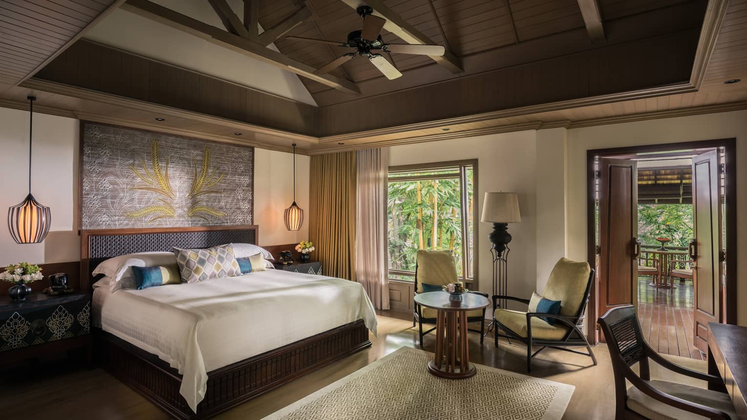Rice Terrace Pavilion room bed, two yellow armchairs between window and door