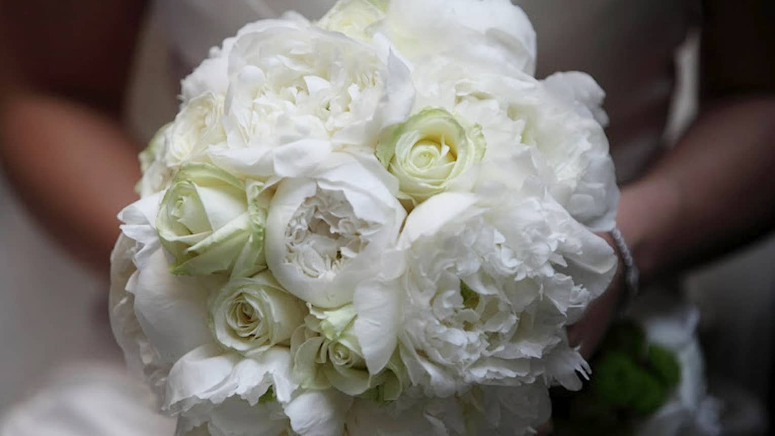 White flowers with roses and peonies creating a beautiful bouquet for the bride on her wedding
