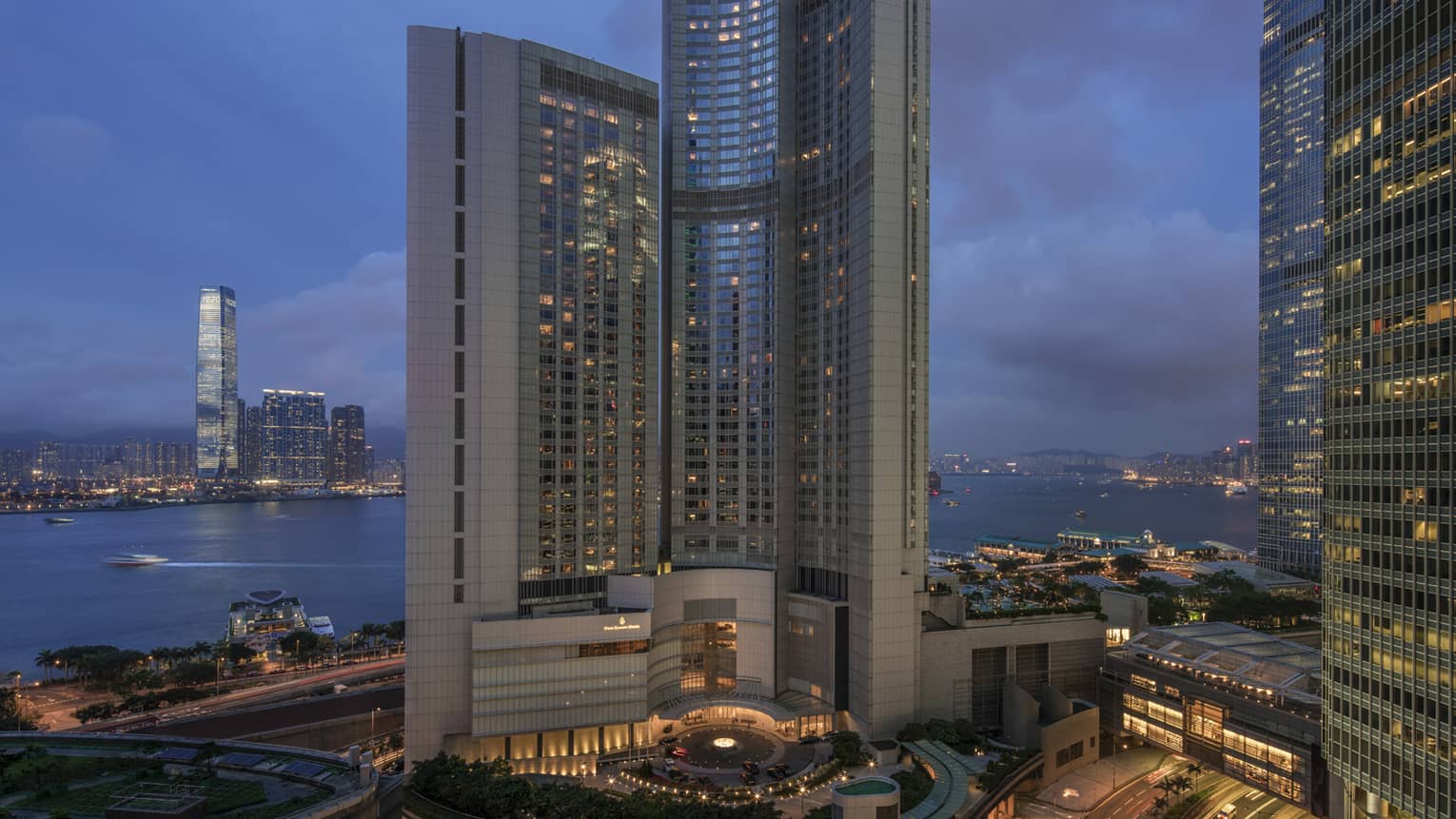 Four Seasons Hotel Hong Kong high rise exterior at dusk