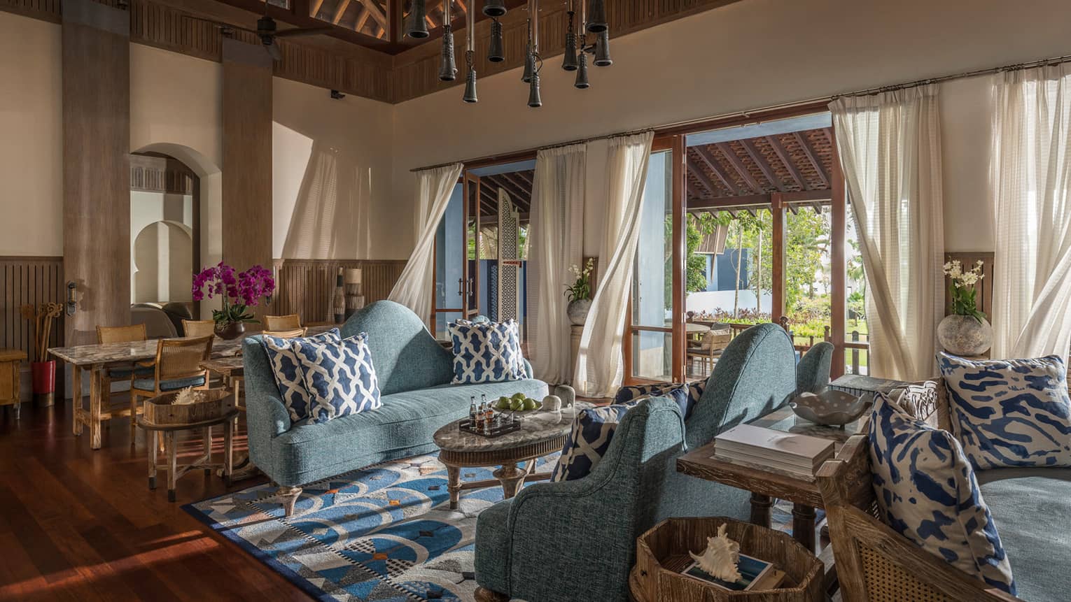 Three Bedroom Villa living room with two soft blue couches and airy views