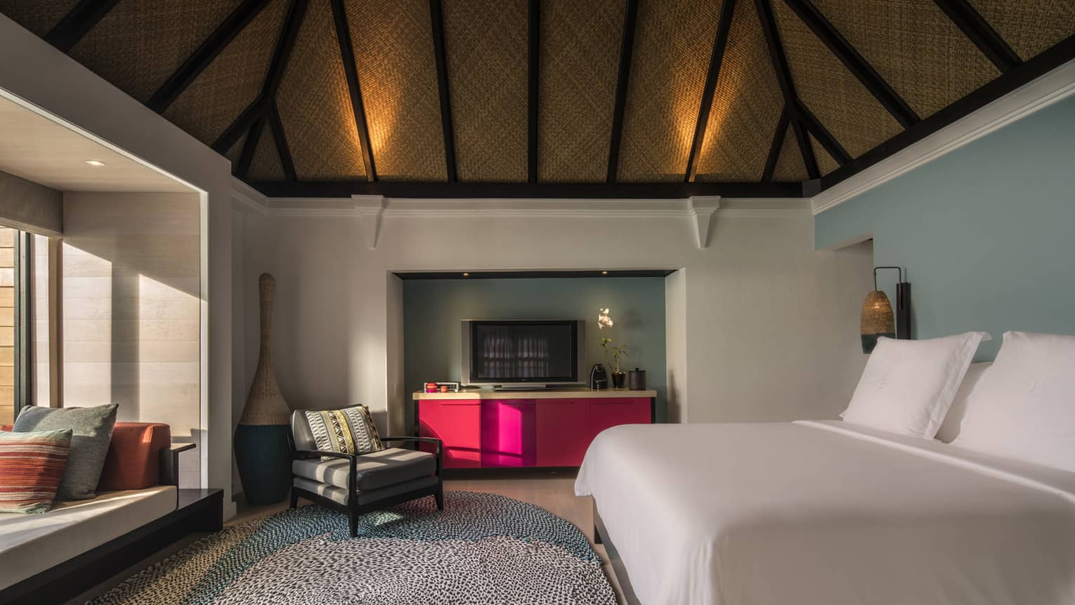 The bedroom of the sunrise water villa
