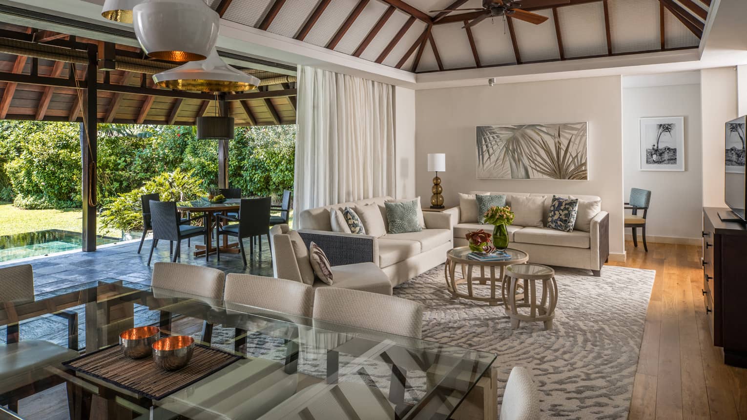 Garden Residence Villa large dining table, modern lights from cathedral ceilings, living room