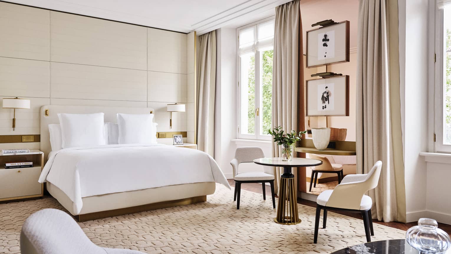 Elegant hotel guest room with king bed and windows