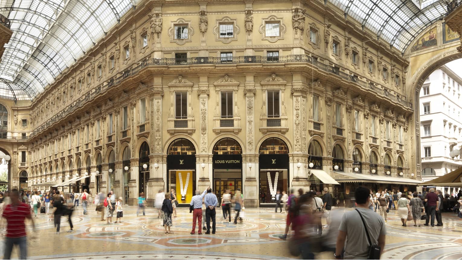 Domed skylight ceilings over historic building facade, indoor shopping centre, Louis Vuitton sign