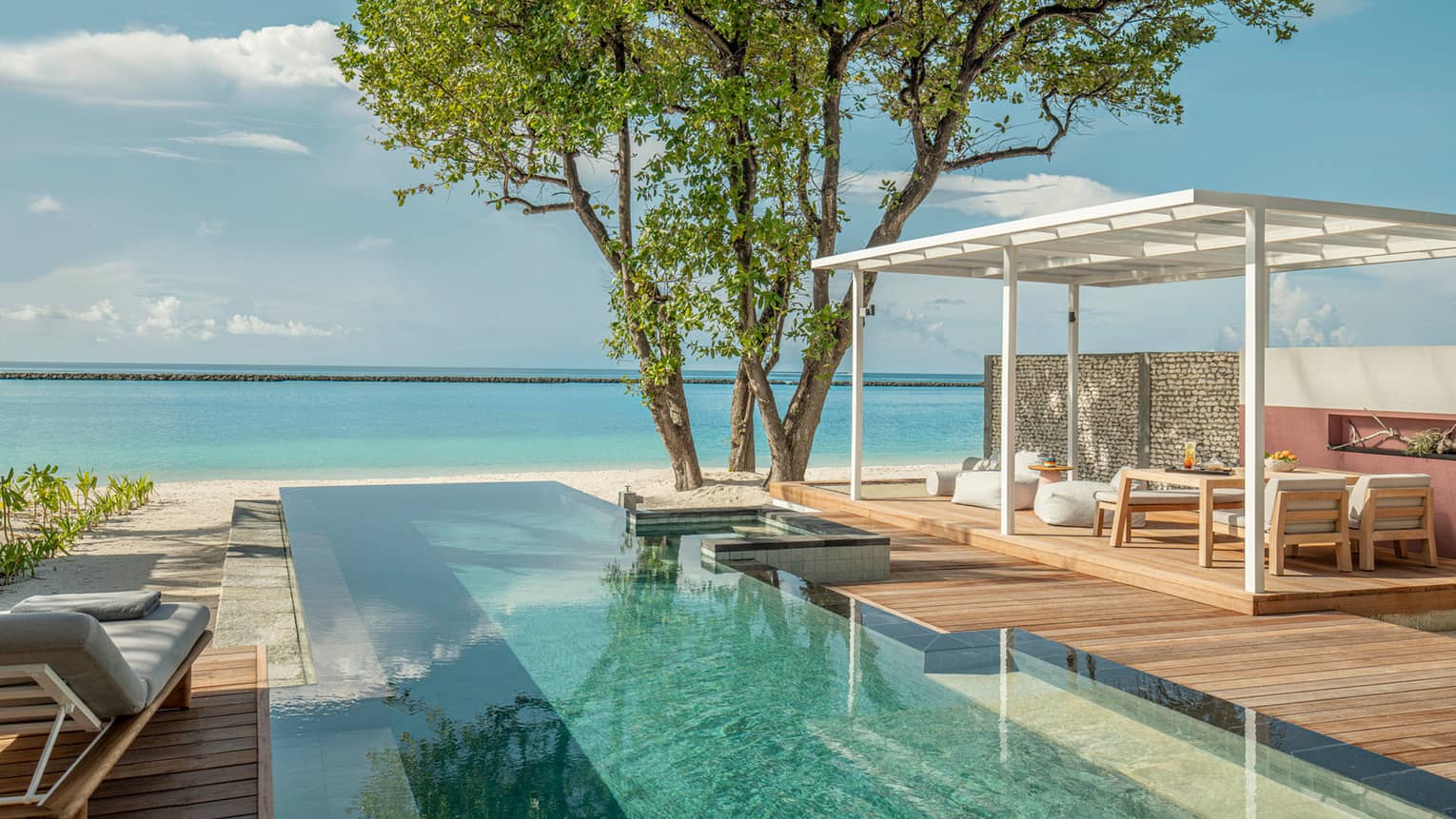 Private pool and lounge deck overlooking Maldivian ocean
