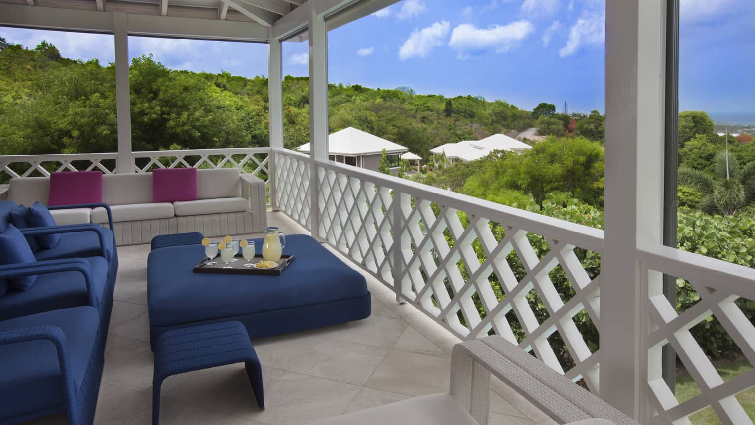 Dark blue patio furniture on balcony with decorative railings