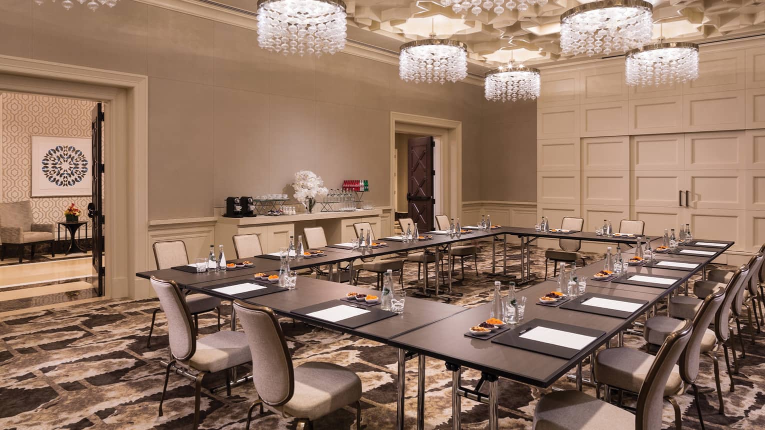 Fox Tail Hollow room with modular meeting table under small crystal chandeliers 