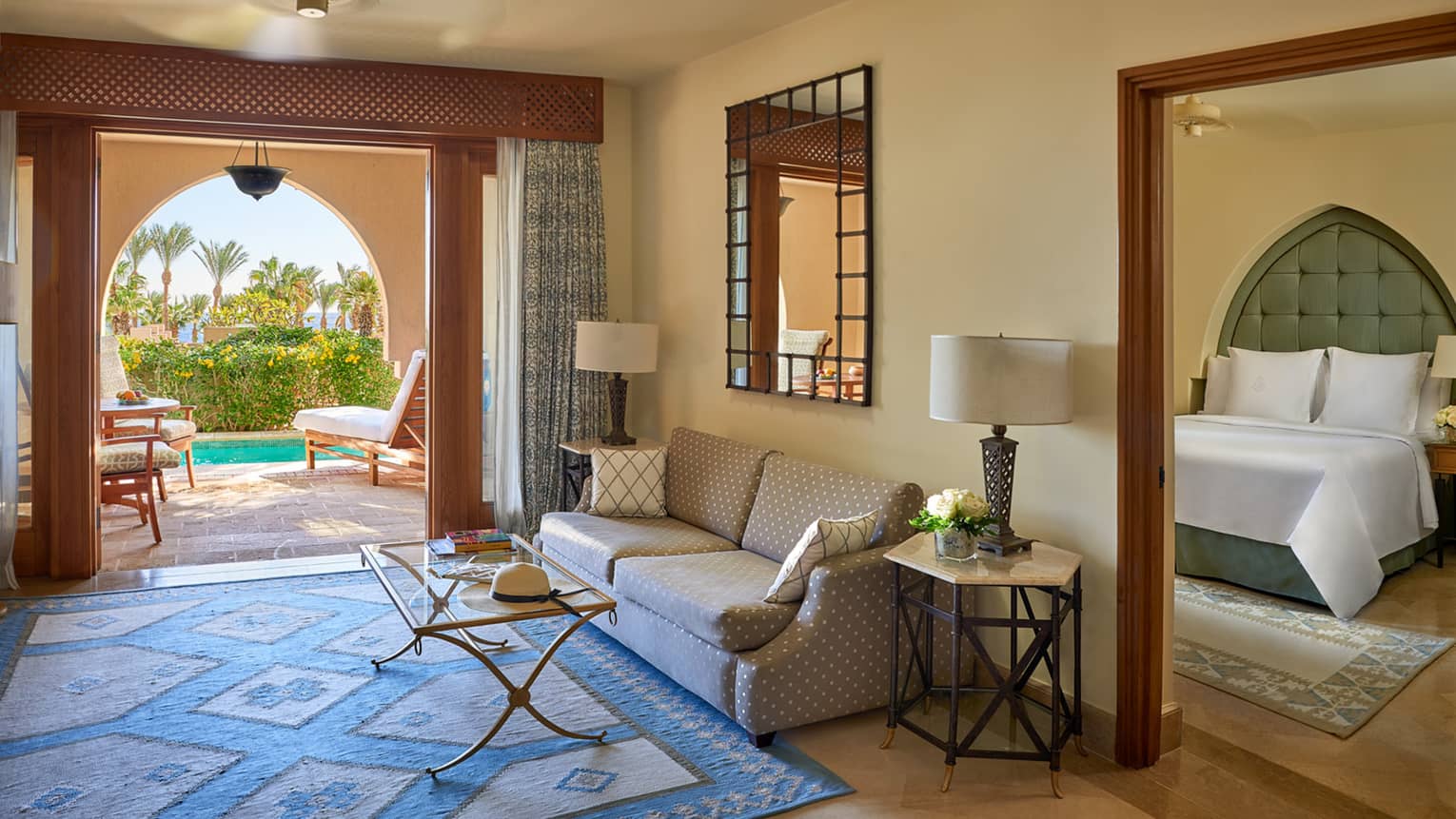 Living area, connected to bedroom, with walk-out entrance to pool area