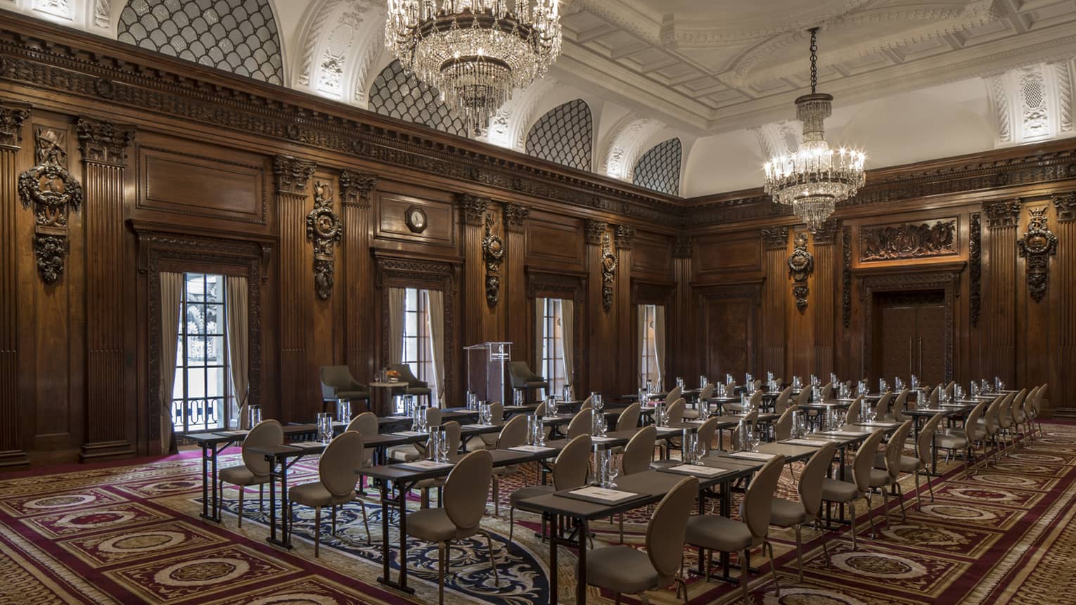 Grand Ballroom conference with rows of meeting tables, chairs facing windows 