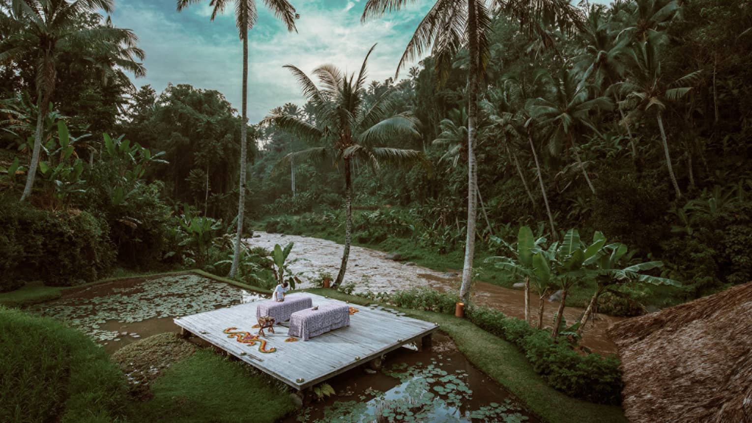 A nighttime spa treatment next to a river in Bali
