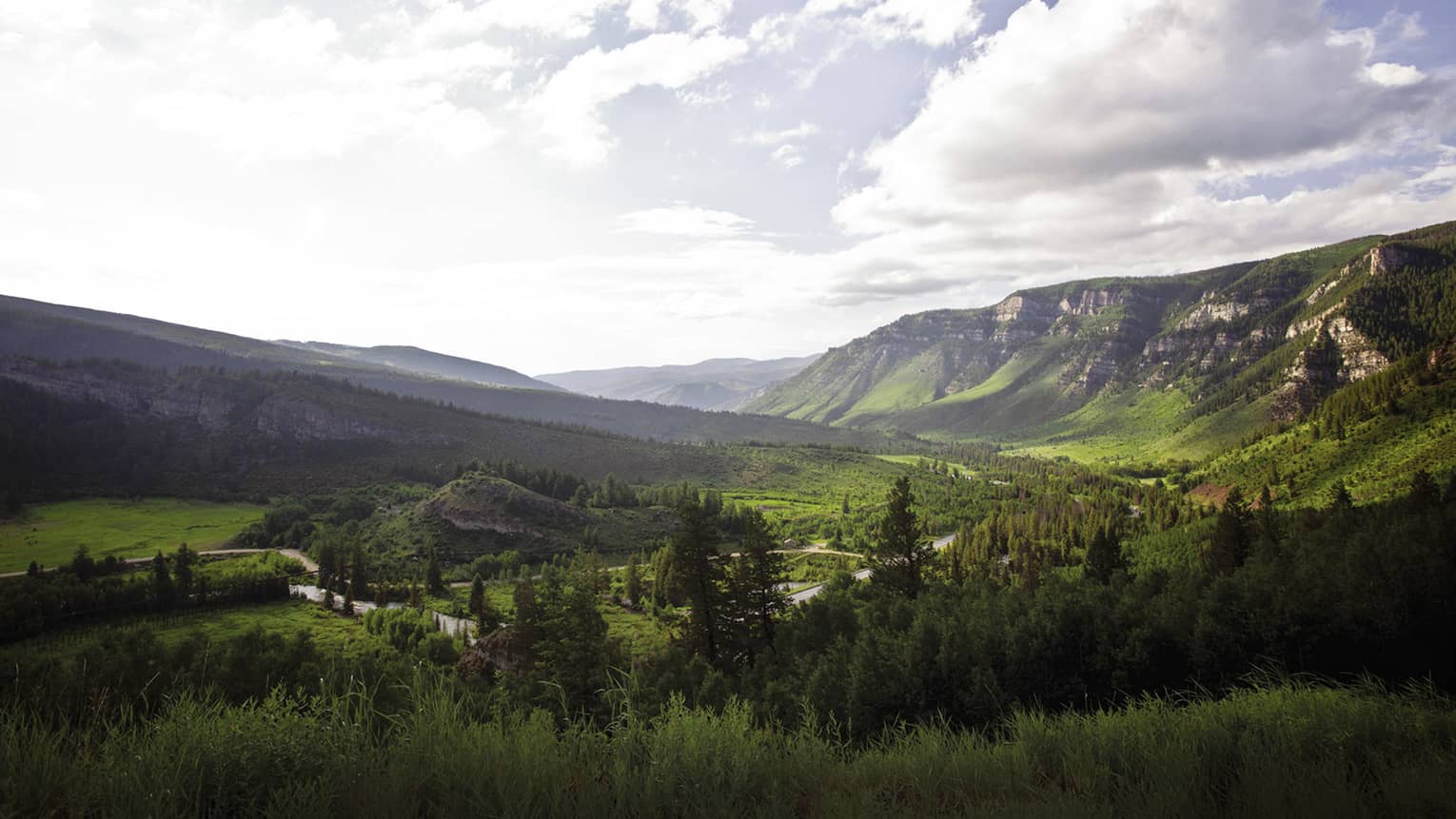 Aerial view of sweeping green mountain range