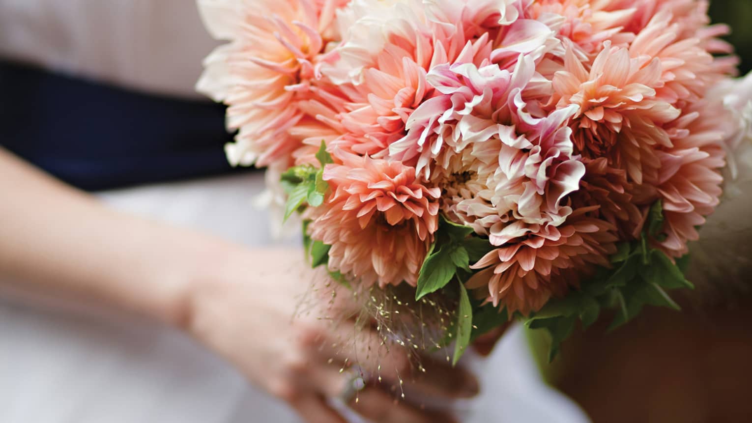 Close up of pink floral wedding bouquet