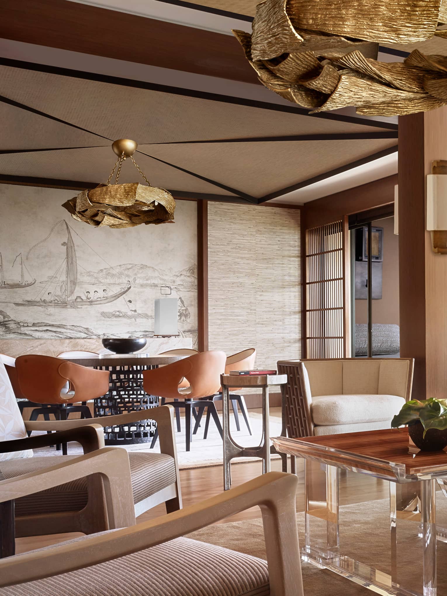 Manele Suite living room with modern furniture with wood accents, shutters, woven pillows
