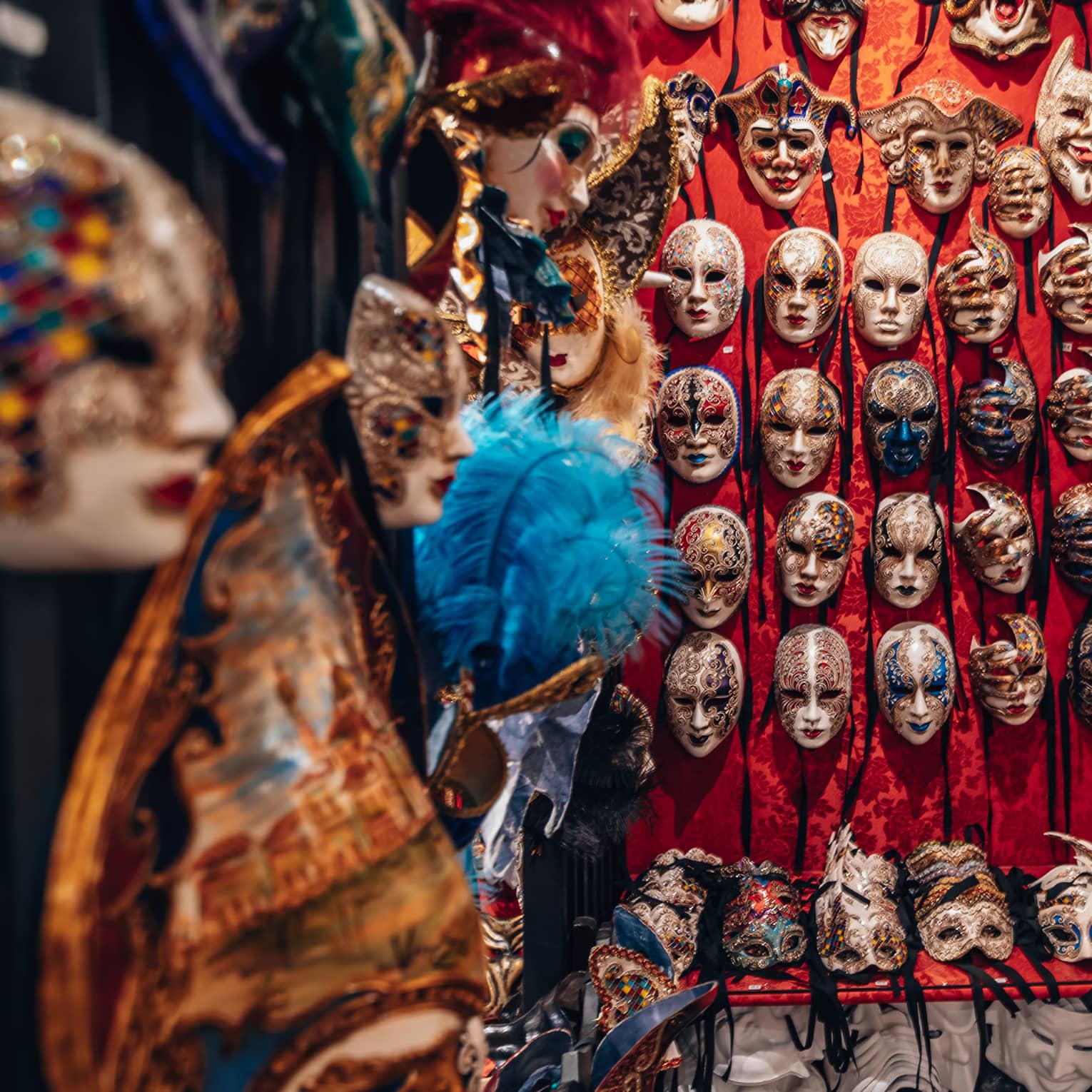 Venetian masks displayed on a wall