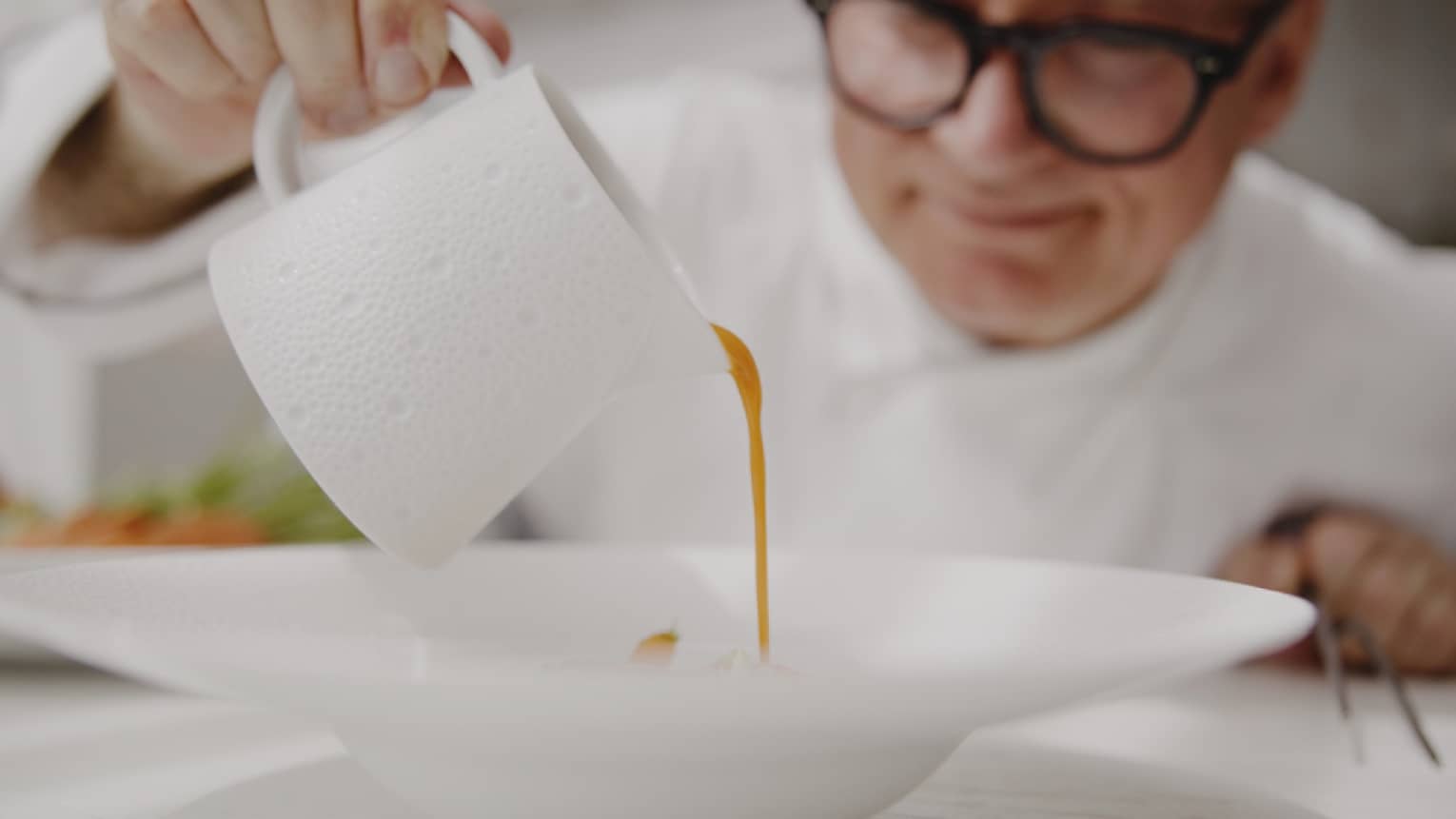 Chef Gaetano Trovato places the finishing touches on a dish