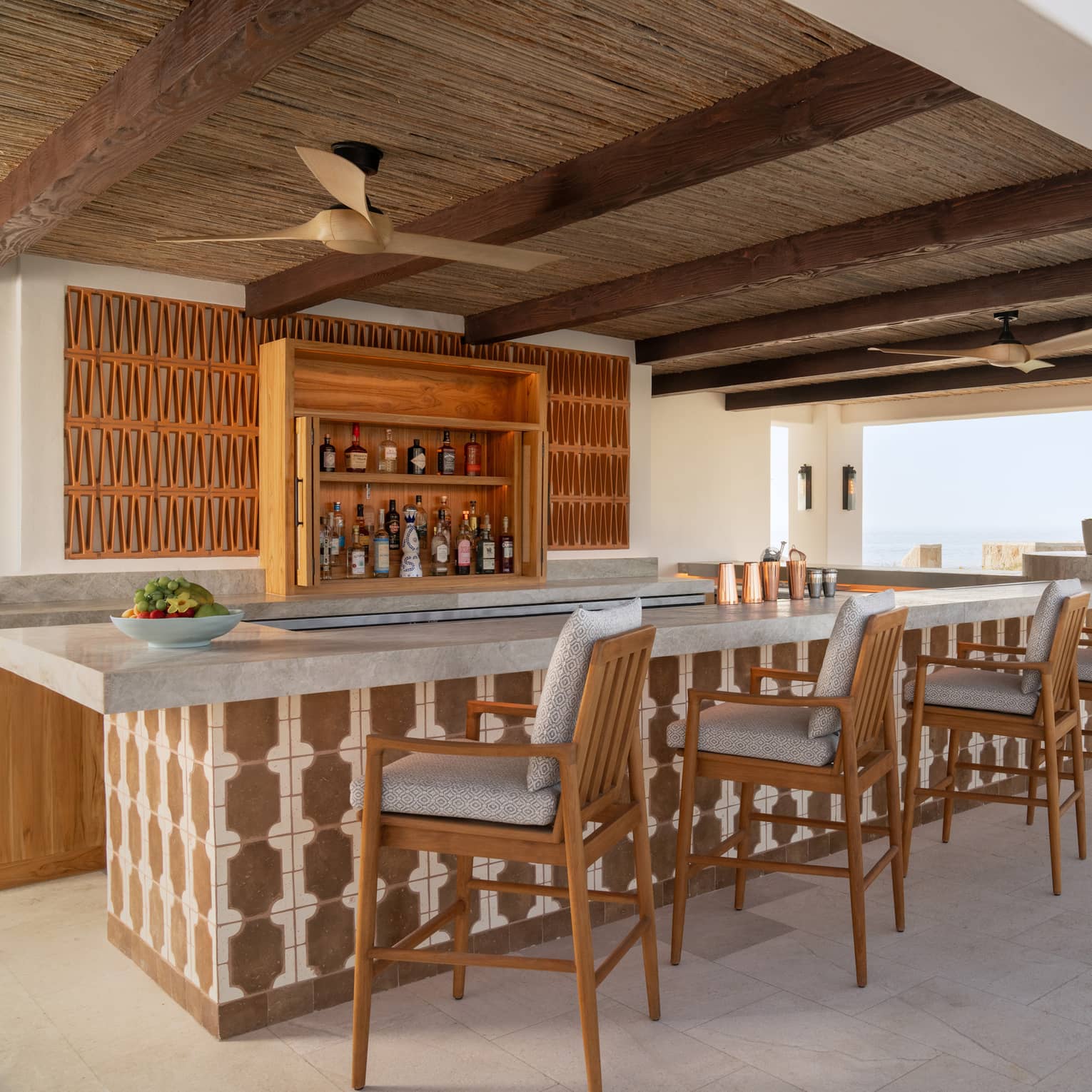 Outdoor, covered Brisol Pool Bar with ocean view at Four Seasons Cabo San Lucas at Cabo Del Sol