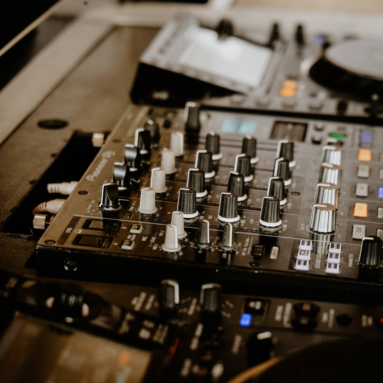 Close up of DJ console and mixing board