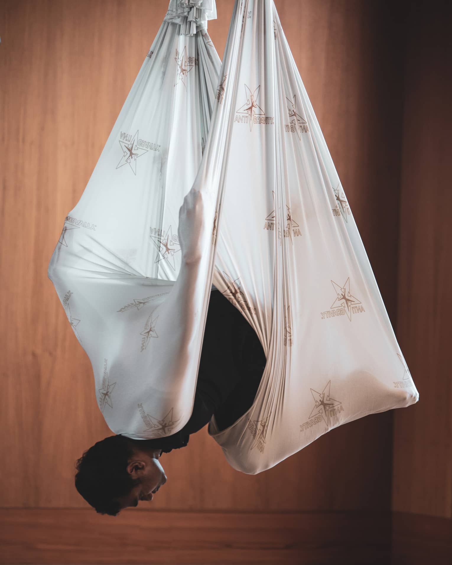 Man does aerial yoga