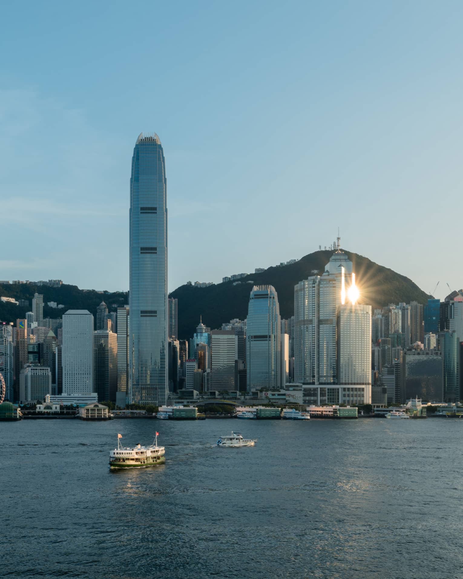Boats on harbour and Hong Kong city in the background