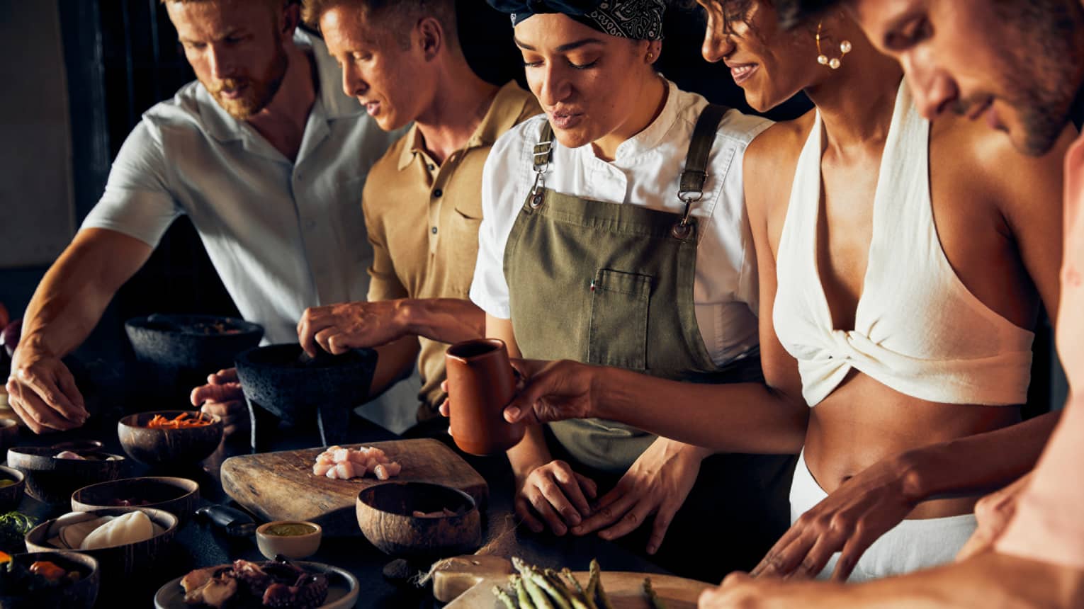 A group of people cooking food.