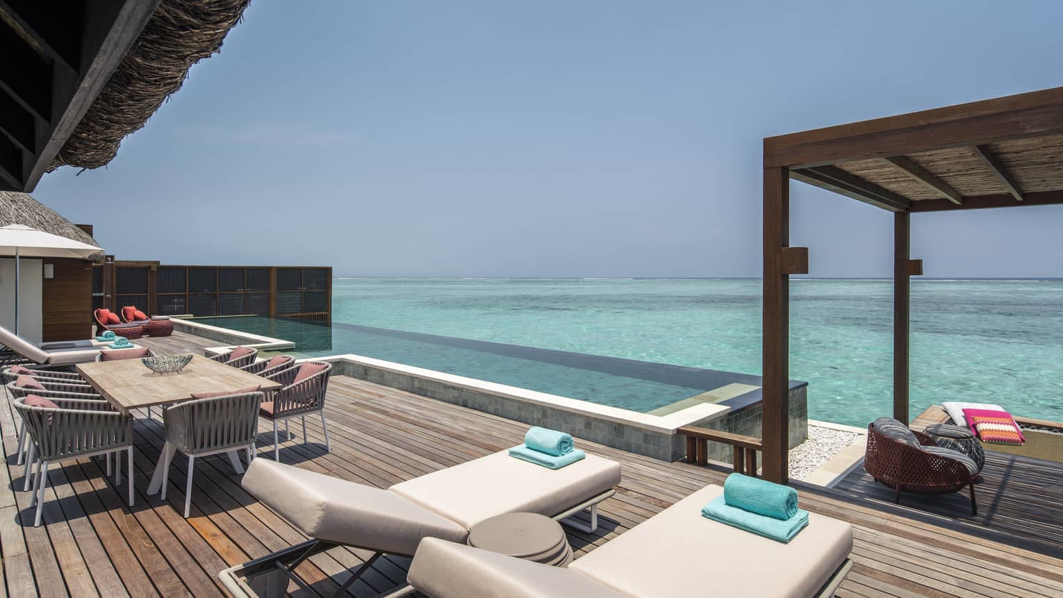 A view of the ocean and plunge pool of sunrise three-bedroom water suite