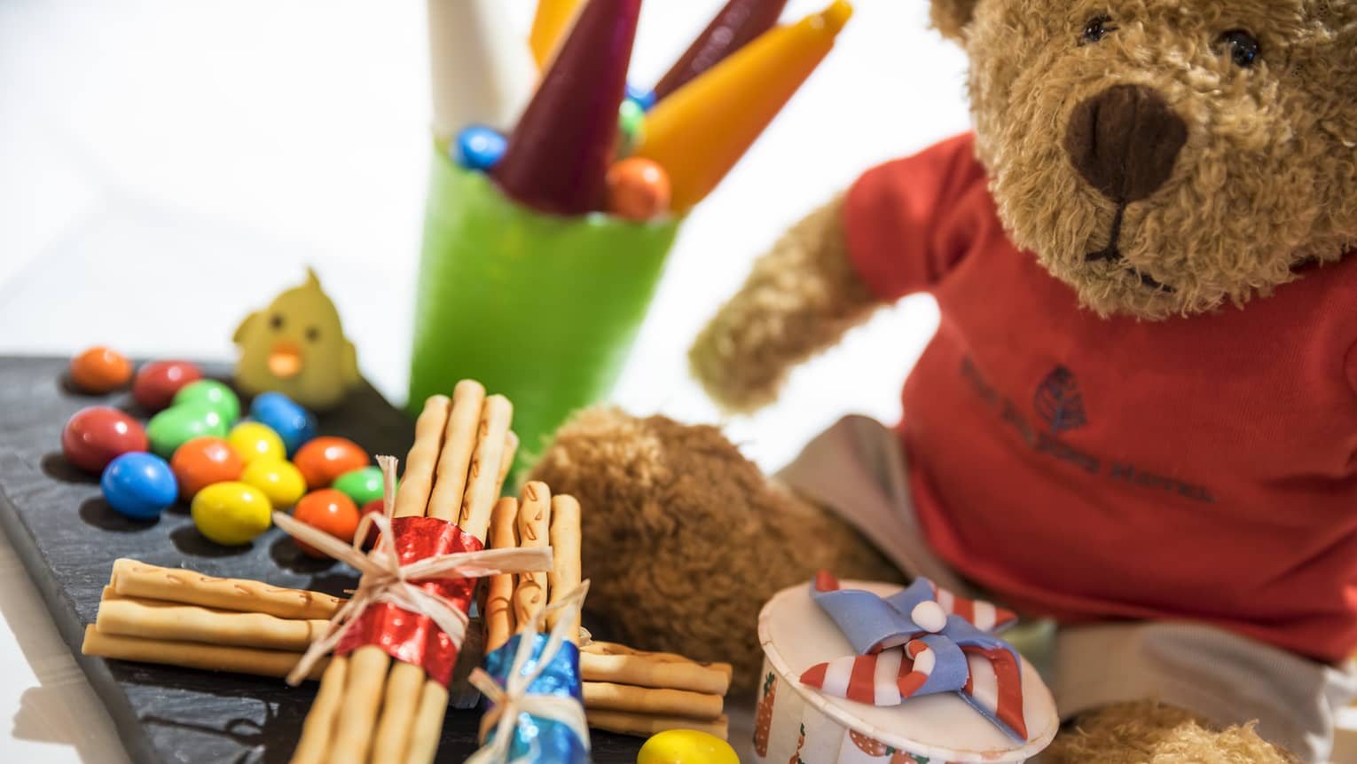 Children's gift package with teddy bear, candy and snacks