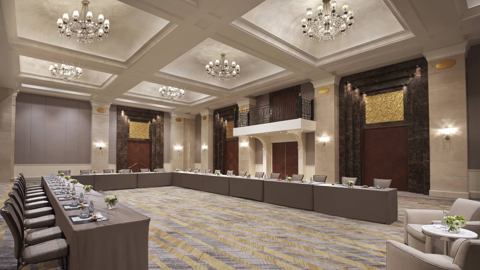 A large series of chairs set up like a boardroom.
