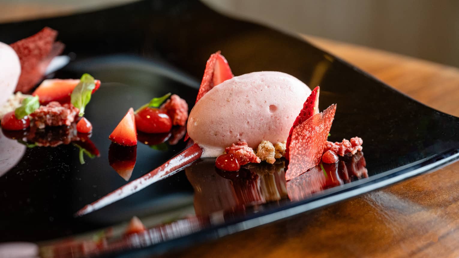 A strawberry sorbet dish with strawberry slices