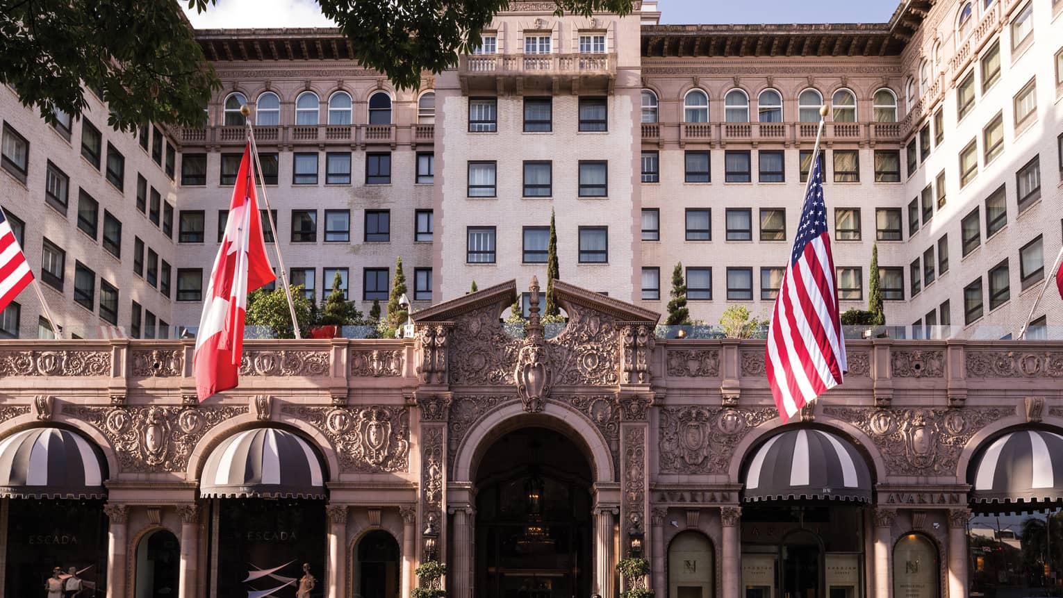 Beverly Wilshire, A Four Seasons Hotel grand front entrance with American, Canadian flags