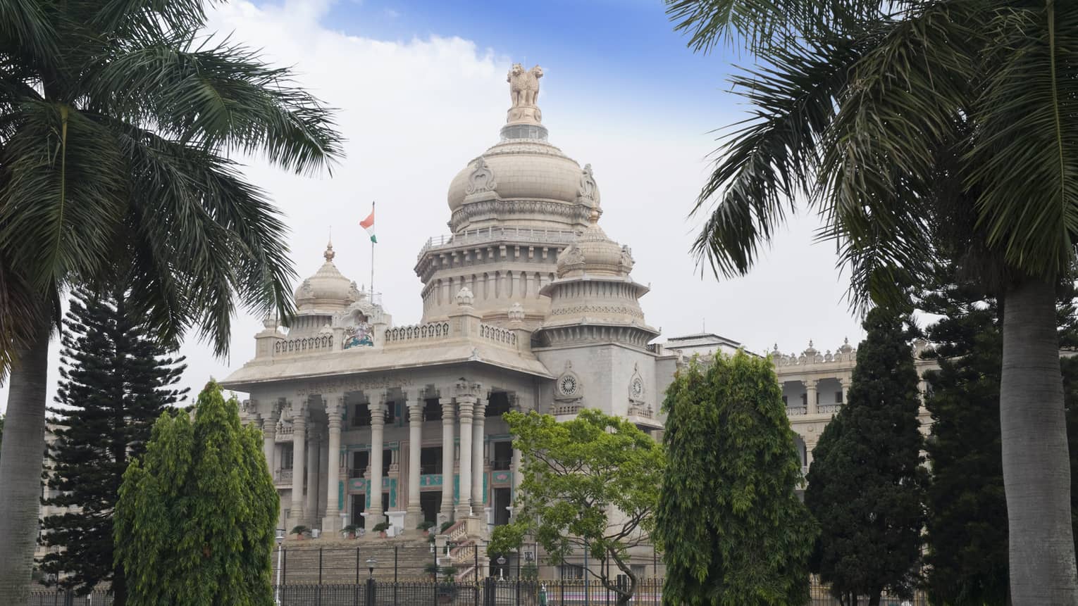 Palm trees in front of Vidhana Soudha government building exterior