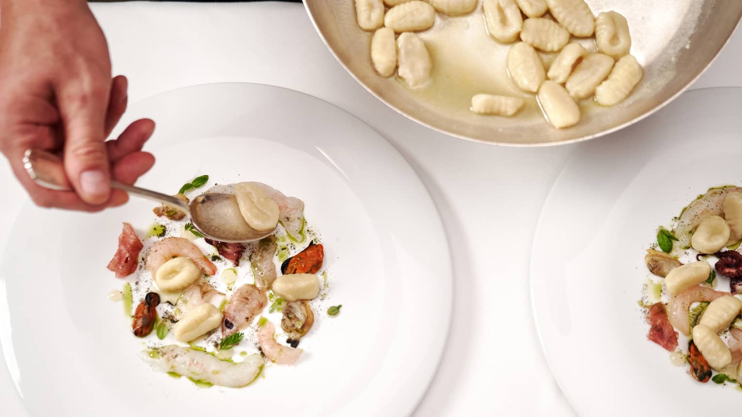 Gnocchi with raw seafood.