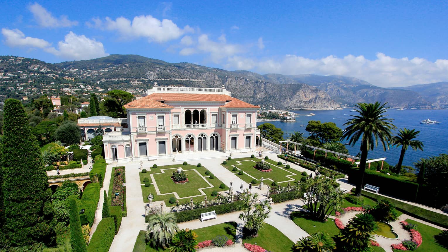 The Grand Hotel, overlooking the water with beautiful arches and pristine gardens