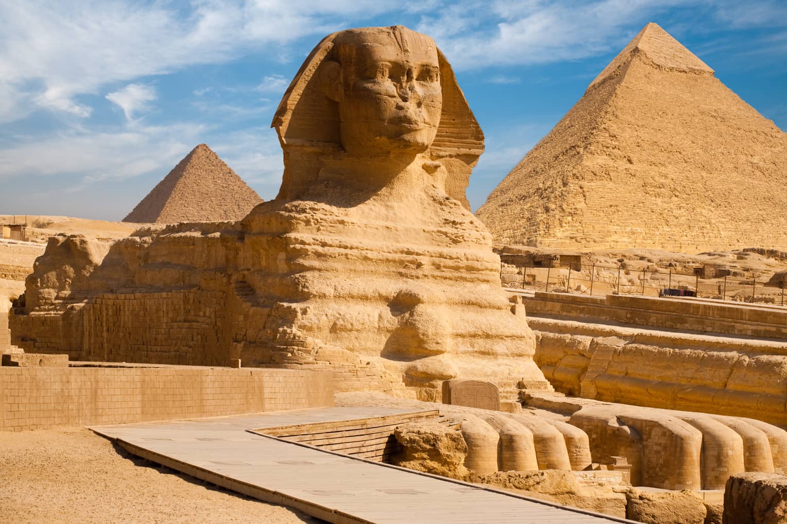 The Great Sphinx including the pyramids in the background