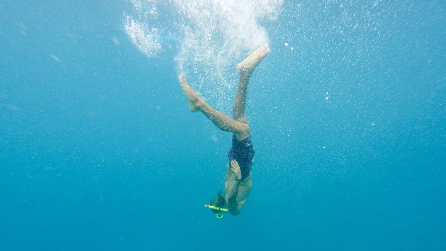 Woman diving underwater in ocean