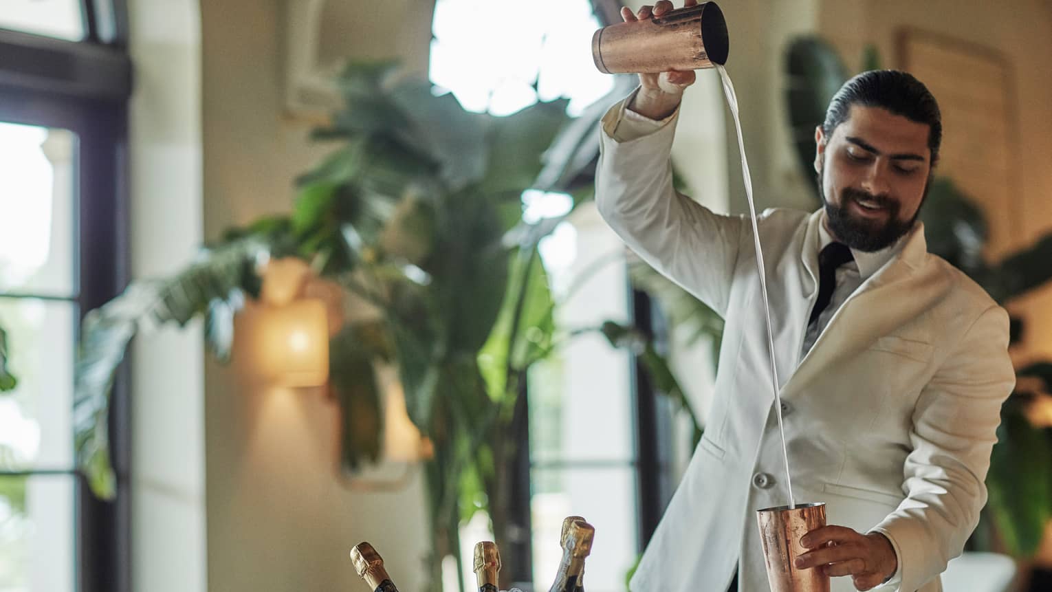 A bartender making a cocktail.